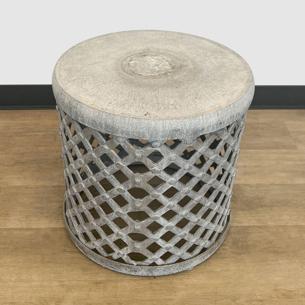 Reperch brand lattice metal side table placed on a wooden floor with a plain backdrop.