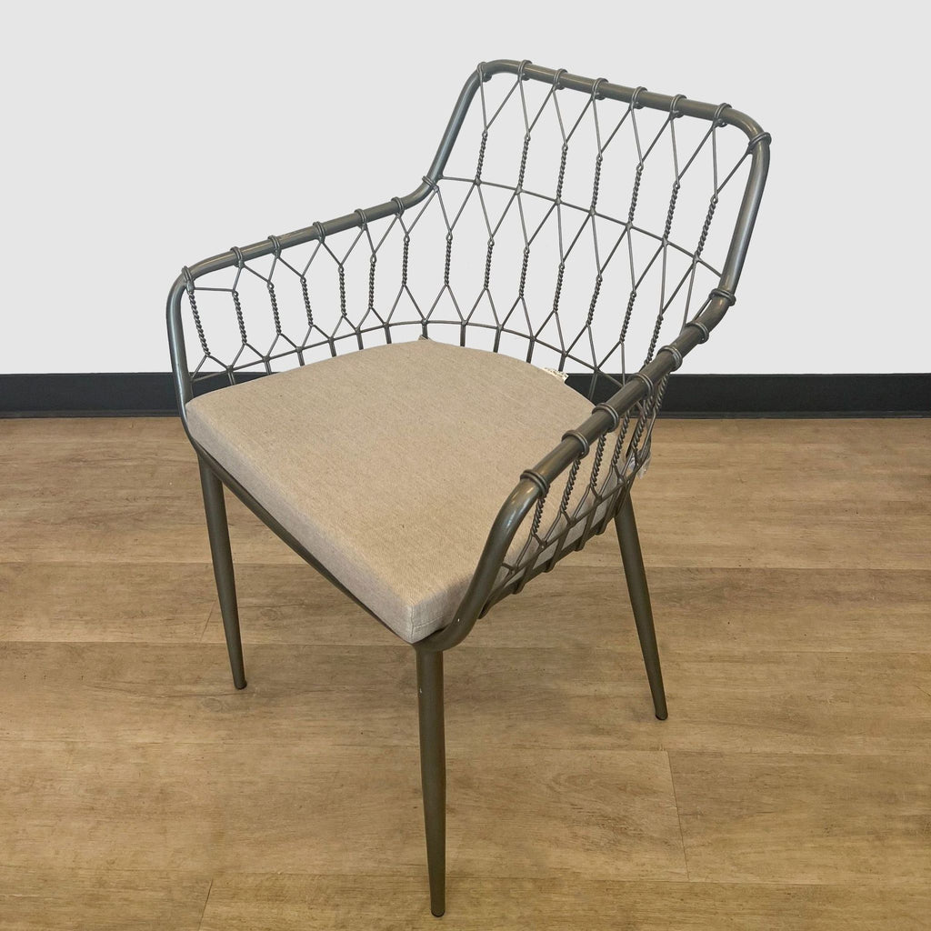 Contemporary-style Reperch dining chair featuring a metal grid back and a comfortable beige fabric seat against a room corner.
