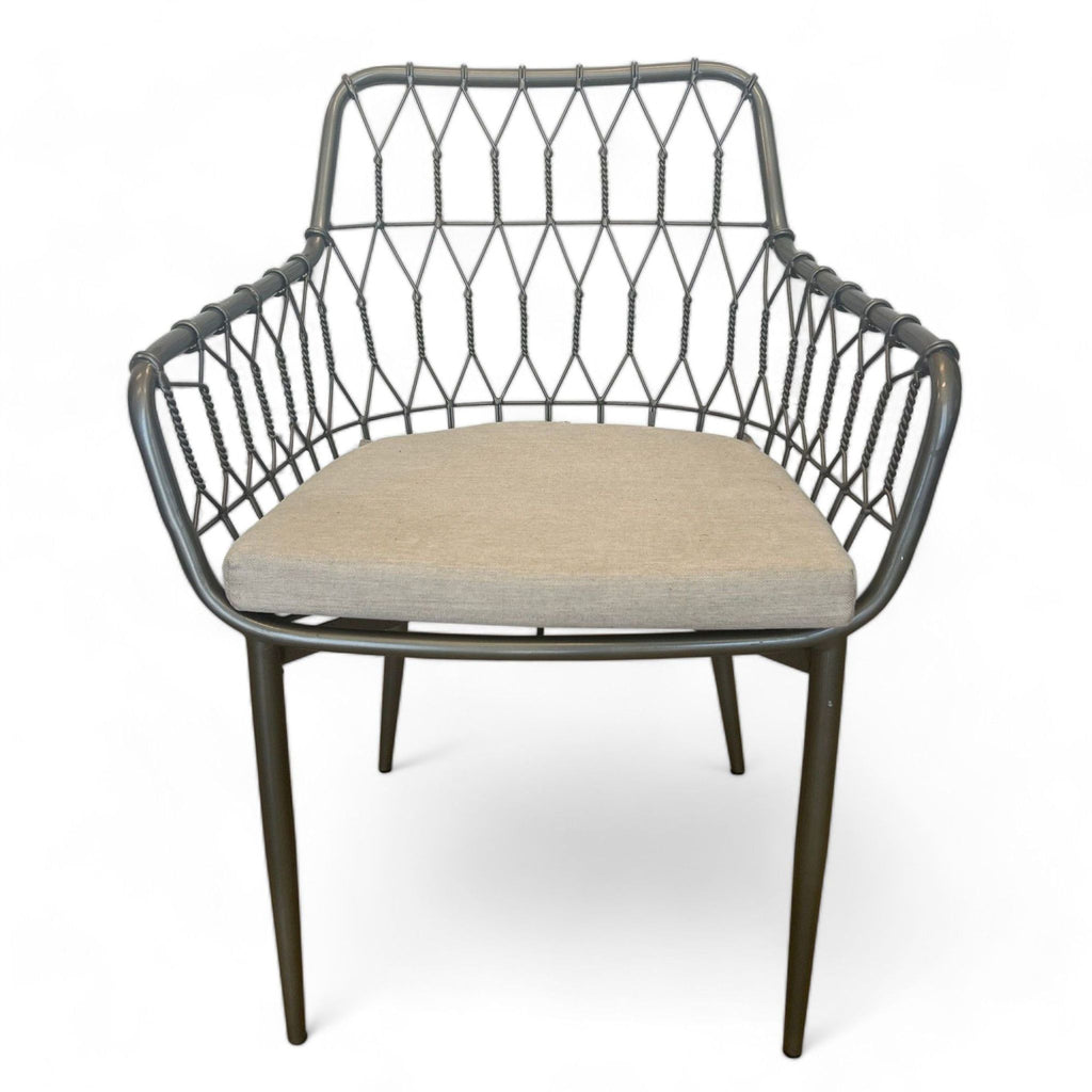 Reperch brand dining chair with a geometric metal back design and a cushioned beige seat.