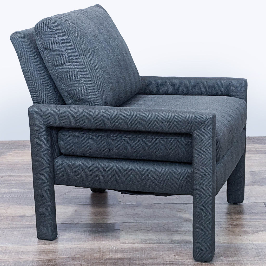 Side angle of HD Buttercup modern charcoal fabric lounge chair, displaying sleek armrests.