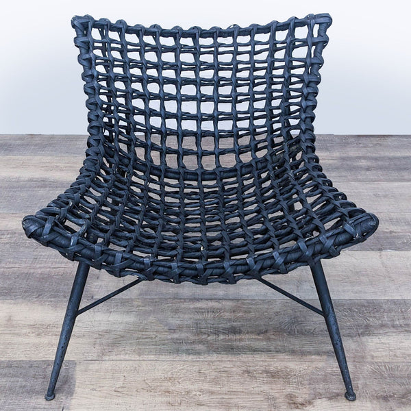 Front view of a Reperch modern wicker lounge chair with a low profile design.