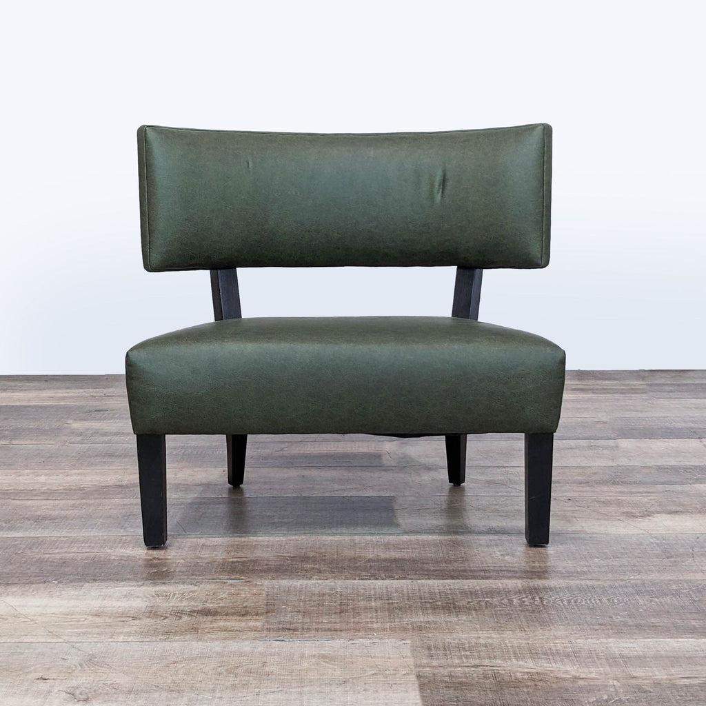 3. Mid-century modern Reperch lounge chair with green faux leather and black legs, front view.