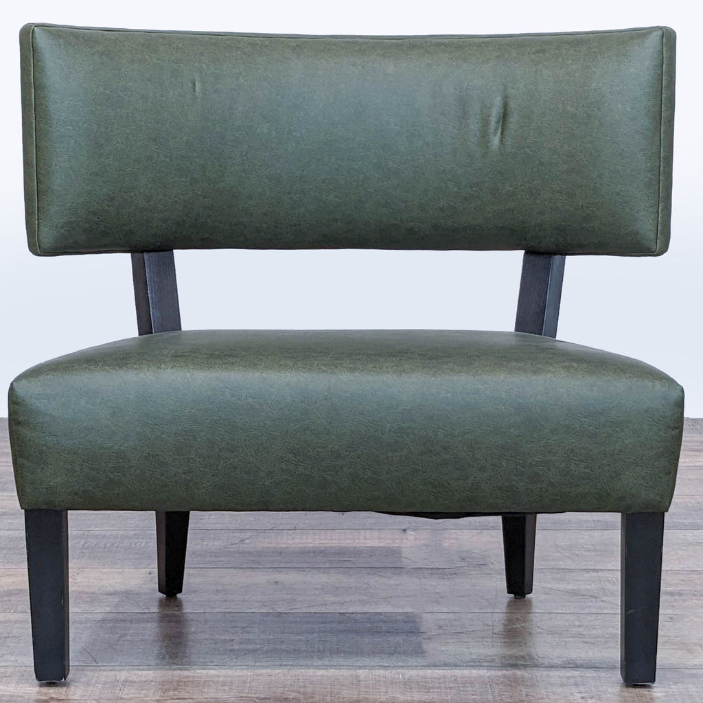 1. Reperch lounge chair with green faux leather and black tapered legs in a mid-century modern style.