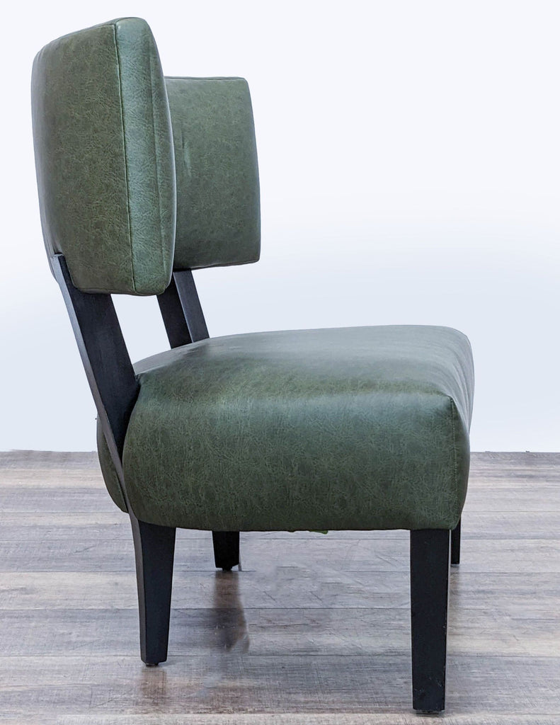 Green upholstered Reperch lounge chair with angle view of seat and backrest.
