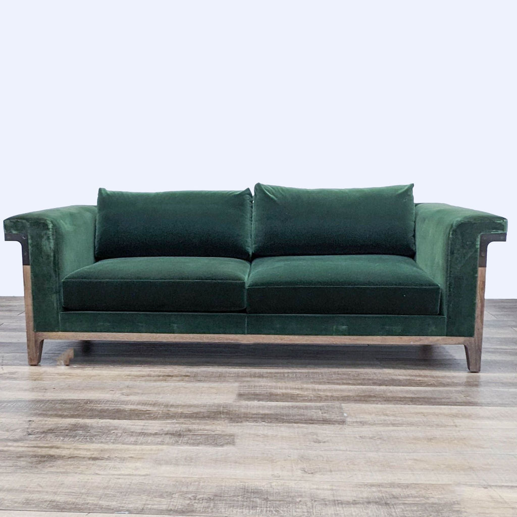 Reperch green velvet 3-seat sofa, wood frame, metal accents, frontal view on wooden floor.
