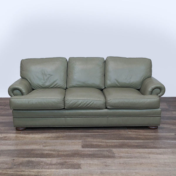 1. A Thomasville three-seat leather sofa in light green with rolled arms and nailhead trim, shown from a front angle.
