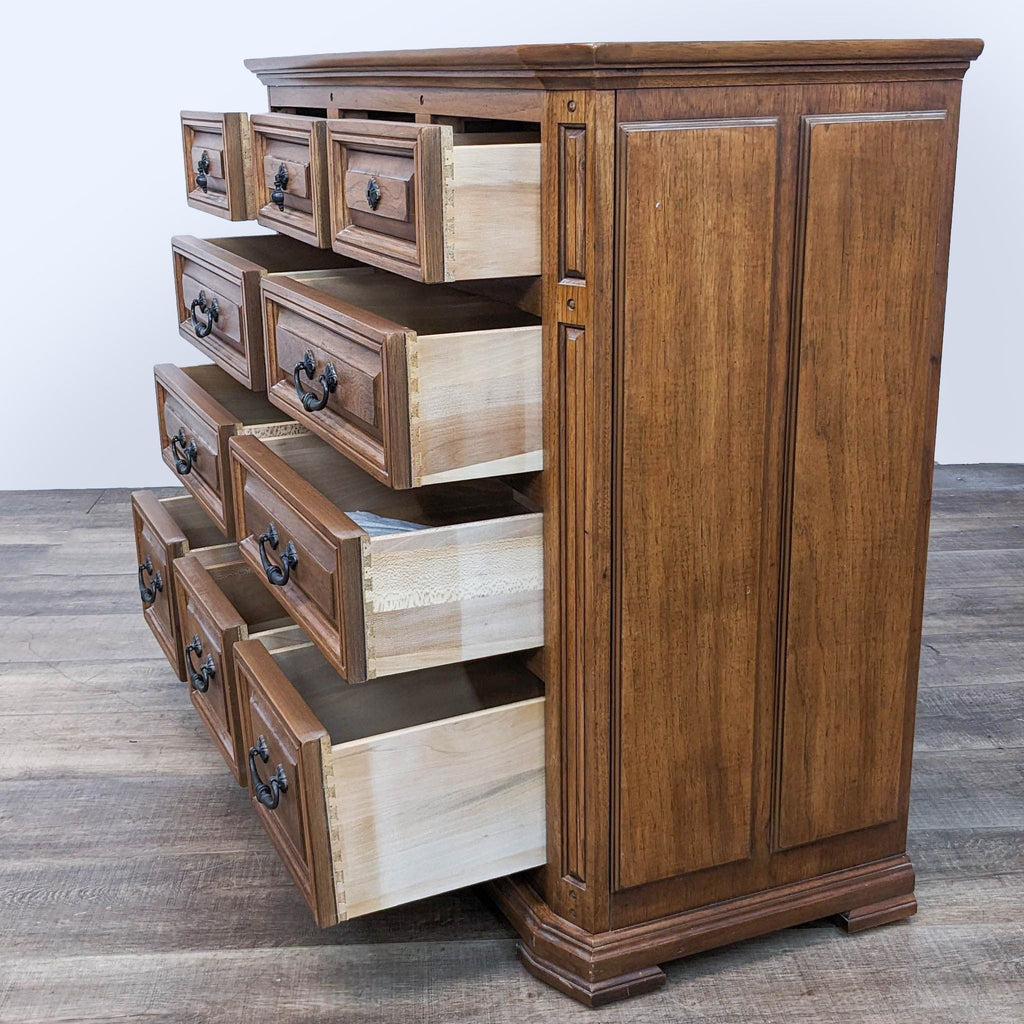 2. Side angle of an open 10-drawer Thomasville dresser showing dovetail joinery and spacious compartments on a simple flooring.