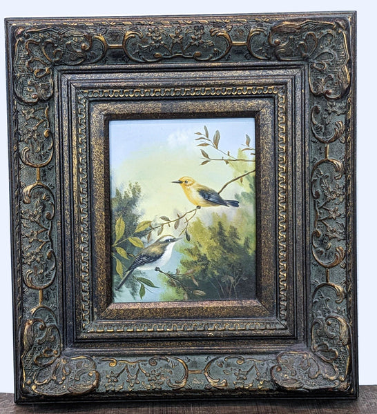 Vintage Reperch painting featuring two birds on a branch, with a detailed ornate frame in greens and blues.