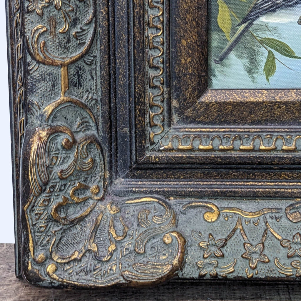 Detailed view of the antique-style ornate frame of a Reperch vintage painting, showcasing intricate botanical motifs.