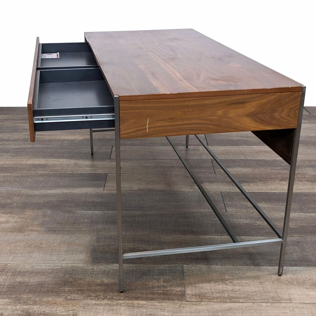 a walnut desk by [ unused0 ] for [ unused0 ]