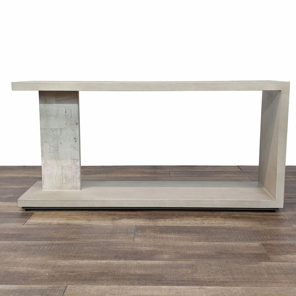 console table is a modern console table with a concrete top and a concrete top. the console is