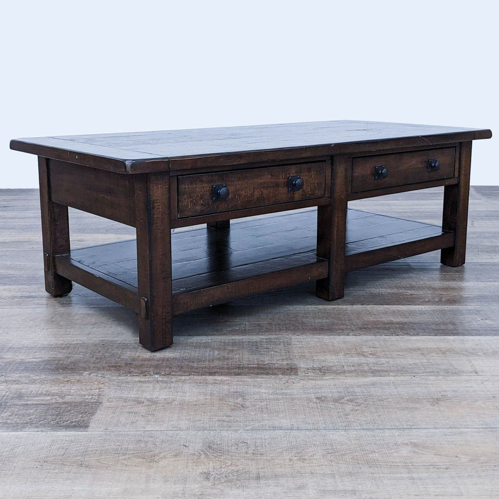 Alt text 3: Angled view of a Pottery Barn coffee table, emphasizing the kiln-dried poplar and veneers with visible textured finish.