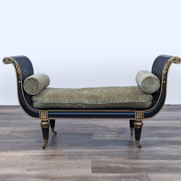 Reperch Empire black bench with cane seat, carved wood frame, gold accents, and removable pillow, front view.