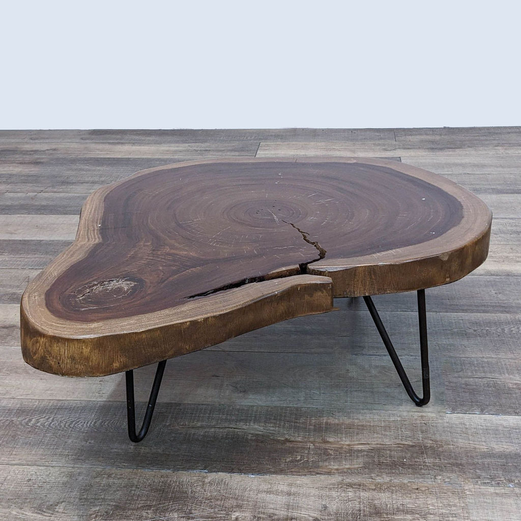 Rustic Reperch coffee table featuring a live edge design and minimalist metal base.