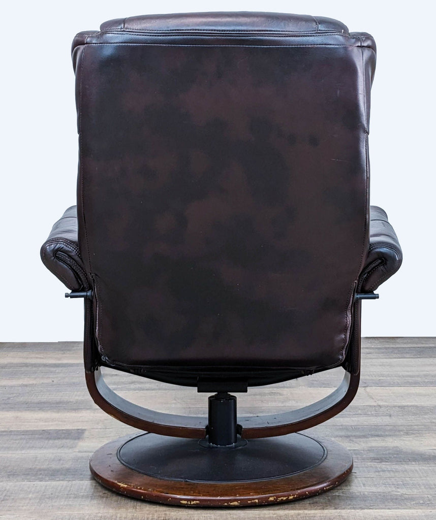 Back view of a True Innovations recliner chair, highlighting the full design and swivel base, suitable for personalized comfort settings.