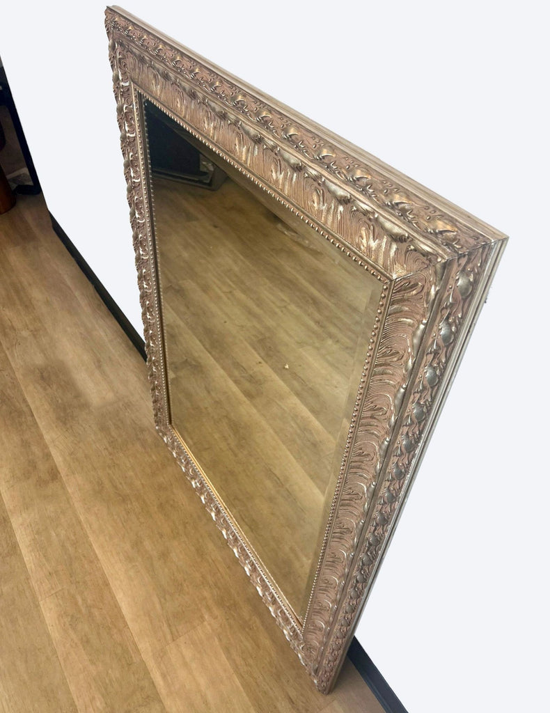 a large antique french silver mirror