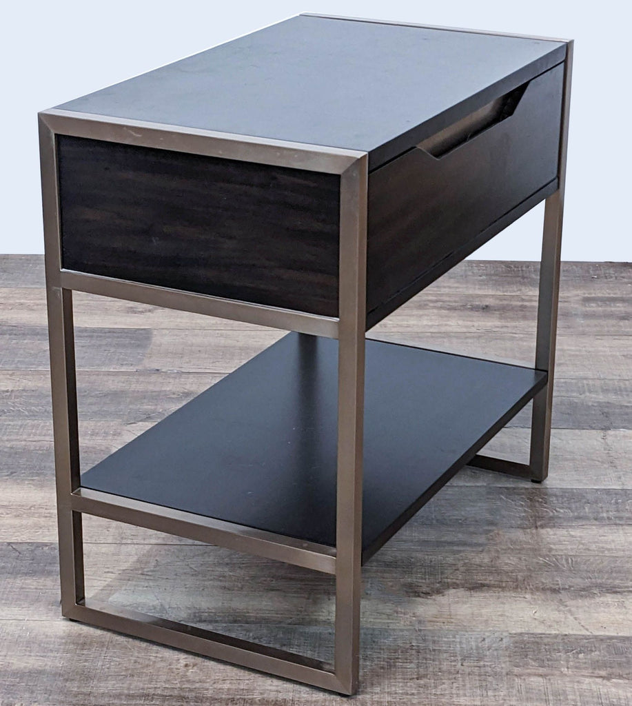 Angle view of Hooker Furnishings end table with closed drawer, metal frame and lower shelf, wooden texture visible.