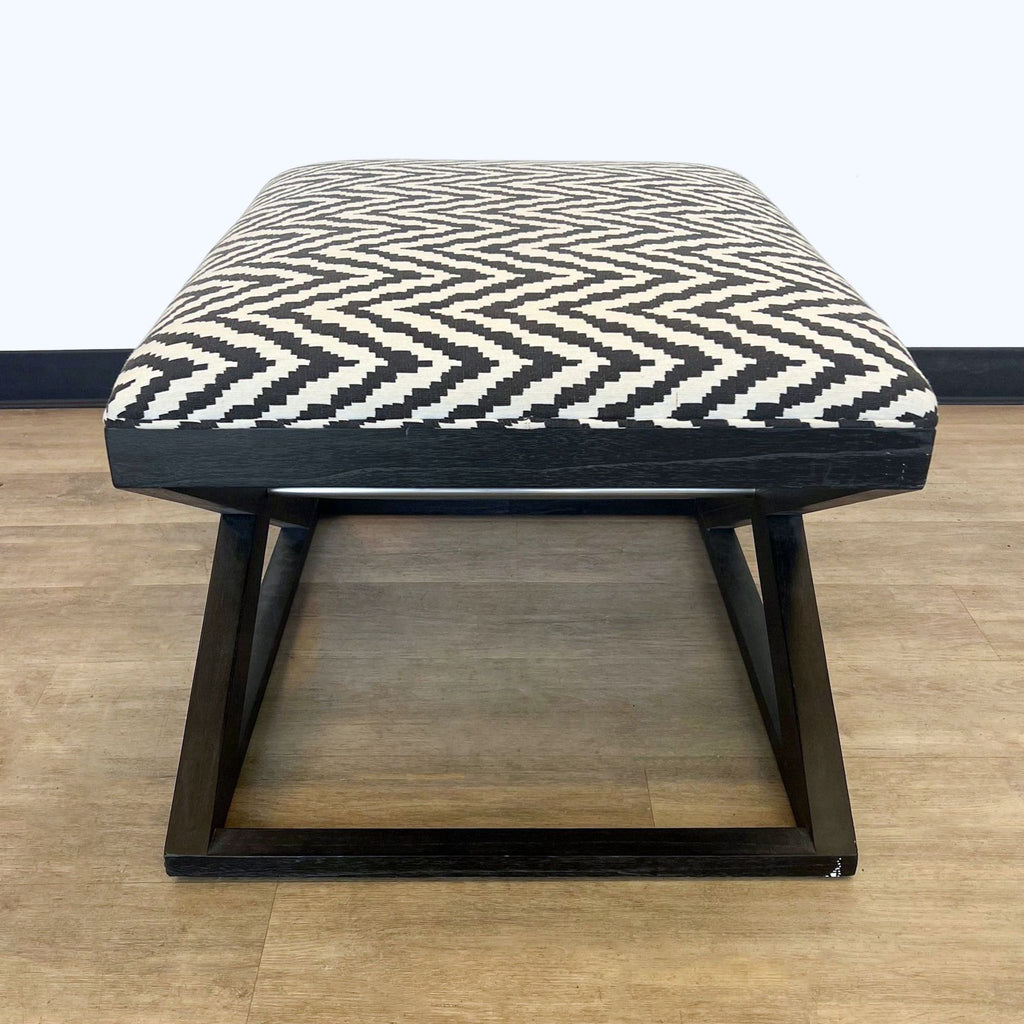 a pair of mid century modern black and white geometric stools
