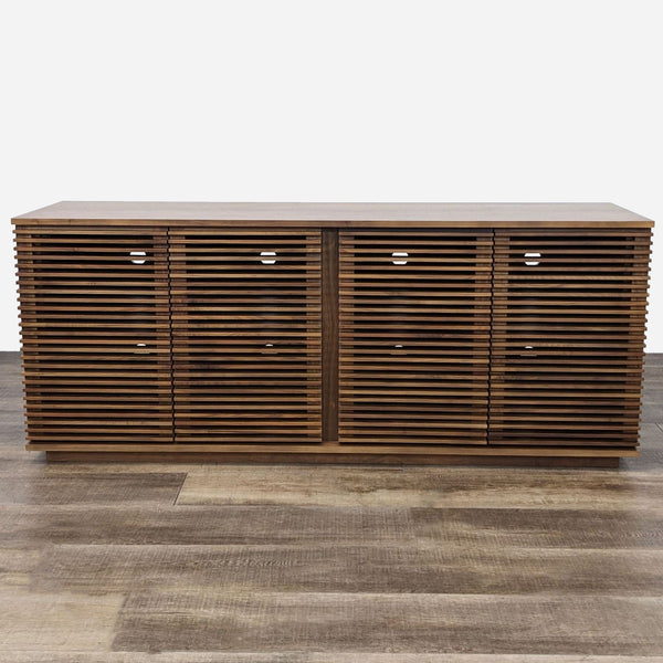 a mid century modern sideboard with three drawers.