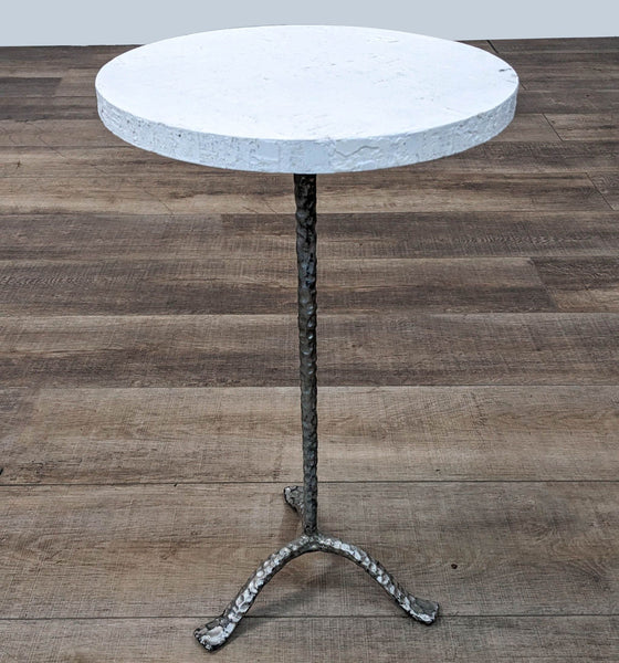 a marble table with a metal base and a metal base.
