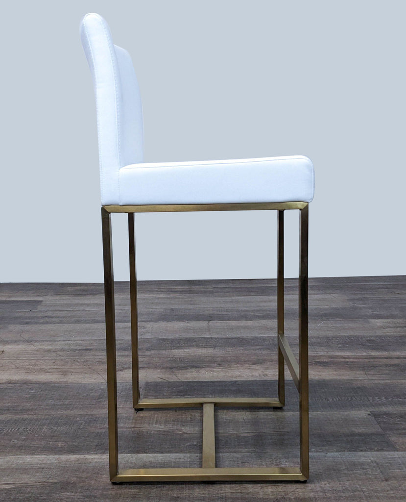 the [ unused0 ] and brass bar stool
