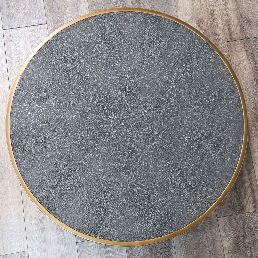 a round coffee table with a gold rim.