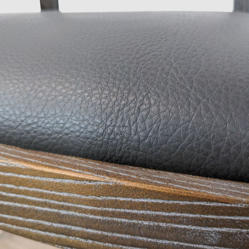 the [ unused0 ] chair in black leather