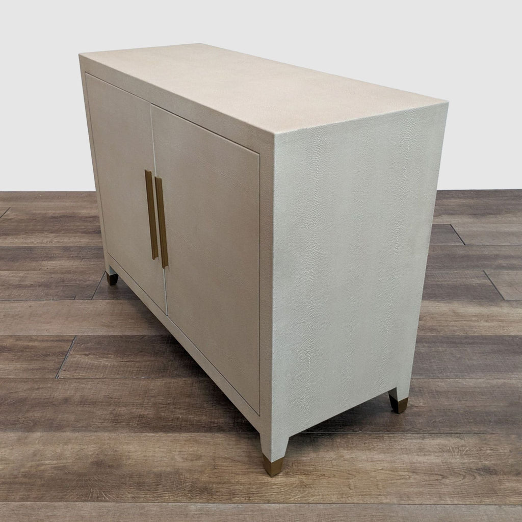 a large, handmade, modern, and minimalist, solid wood storage cabinet with a brass