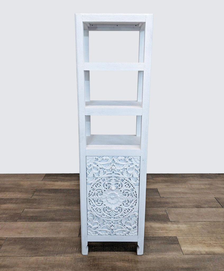 White tropical hardwood bookshelf with detailed floral carving.
