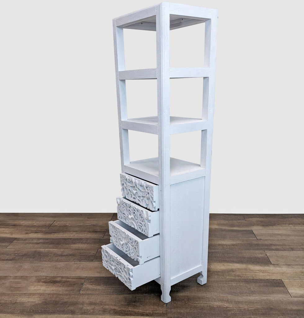 Bookshelf with floral carved drawers open, showcasing tropical wood finish.