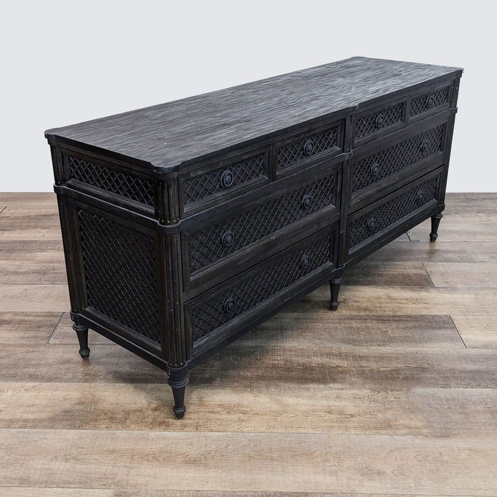 a large black lacquered chest of drawers