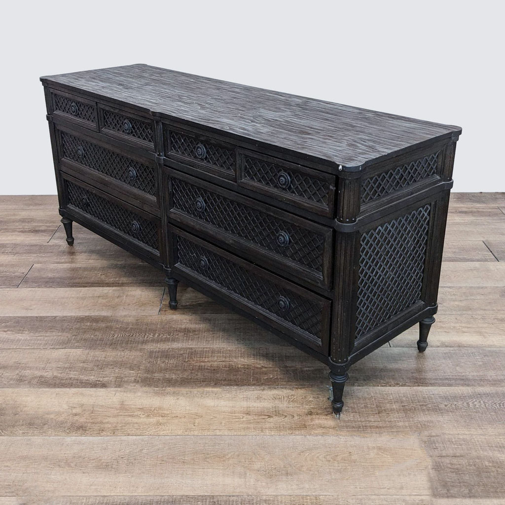 a large, antique, black chest of drawers with a black finish.