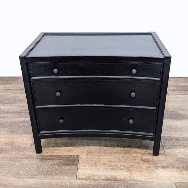 a black dresser with a drawer and a drawer.