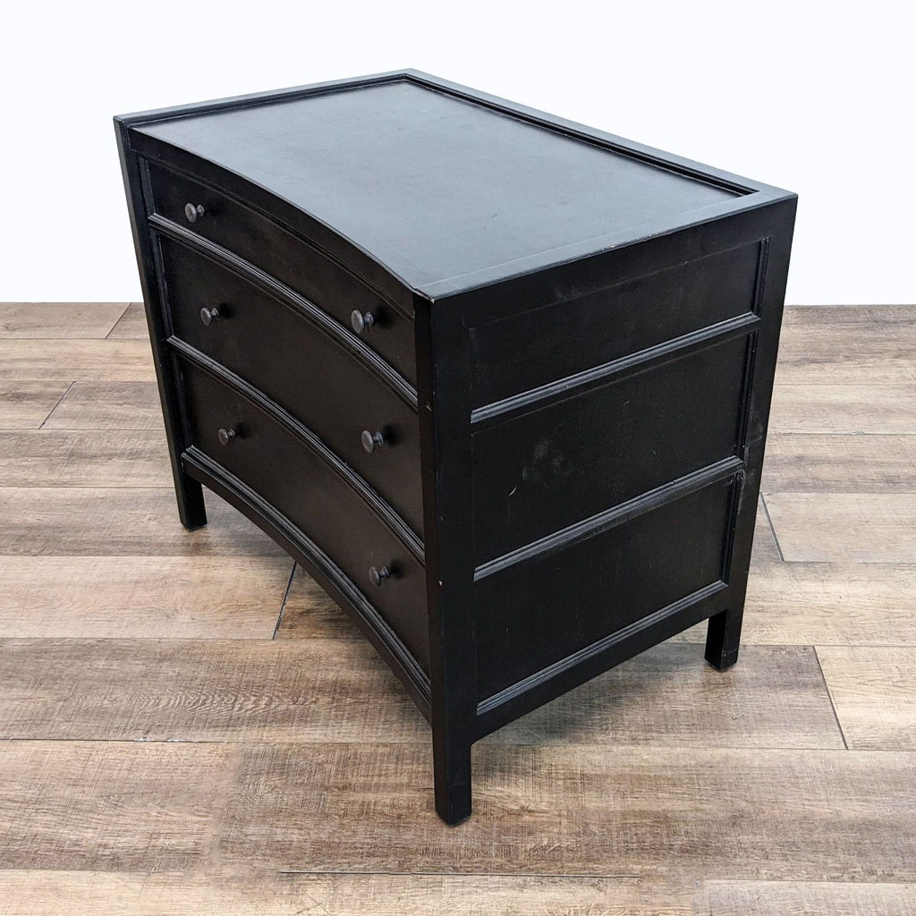 a black painted chest of drawers