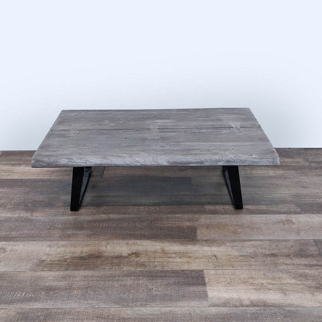 the coffee table is made from reclaimed wood.