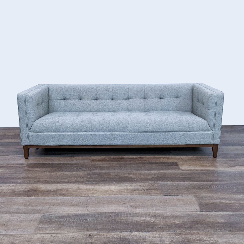 the [ unused0 ] sofa is a modern sofa that is made of soft grey fabric.