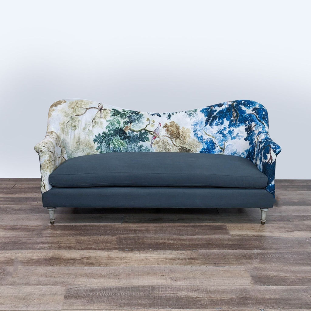a blue sofa with a floral pattern