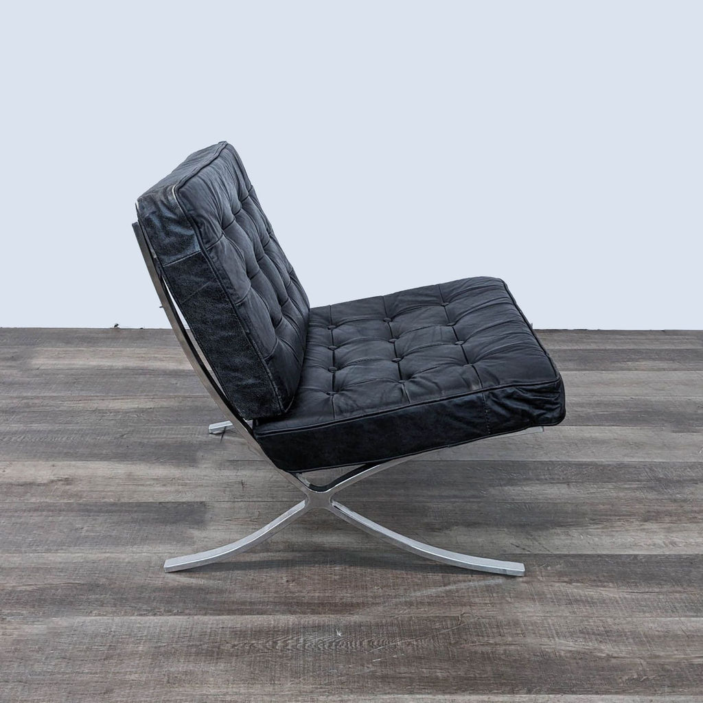 a black leather lounge chair with a black leather upholstery.