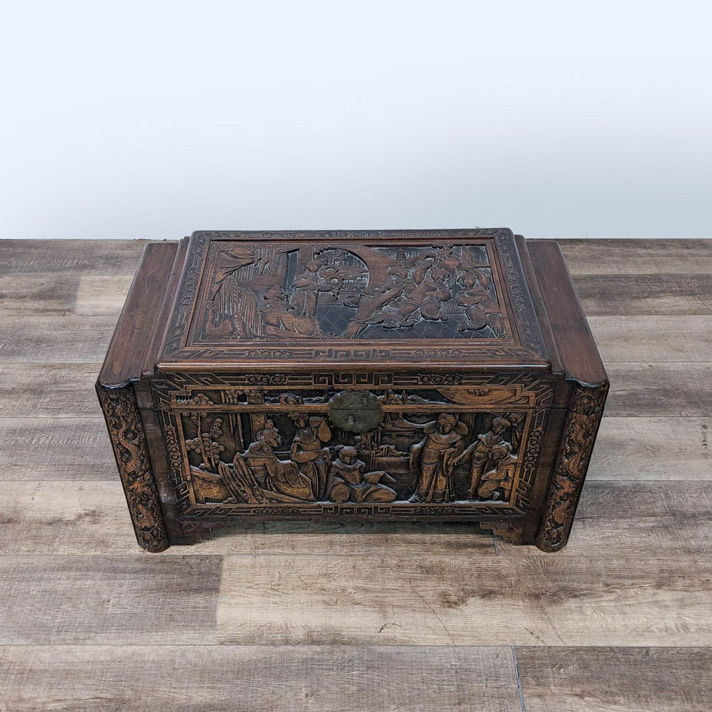 a chinese carved wood box with a relief of the three kings