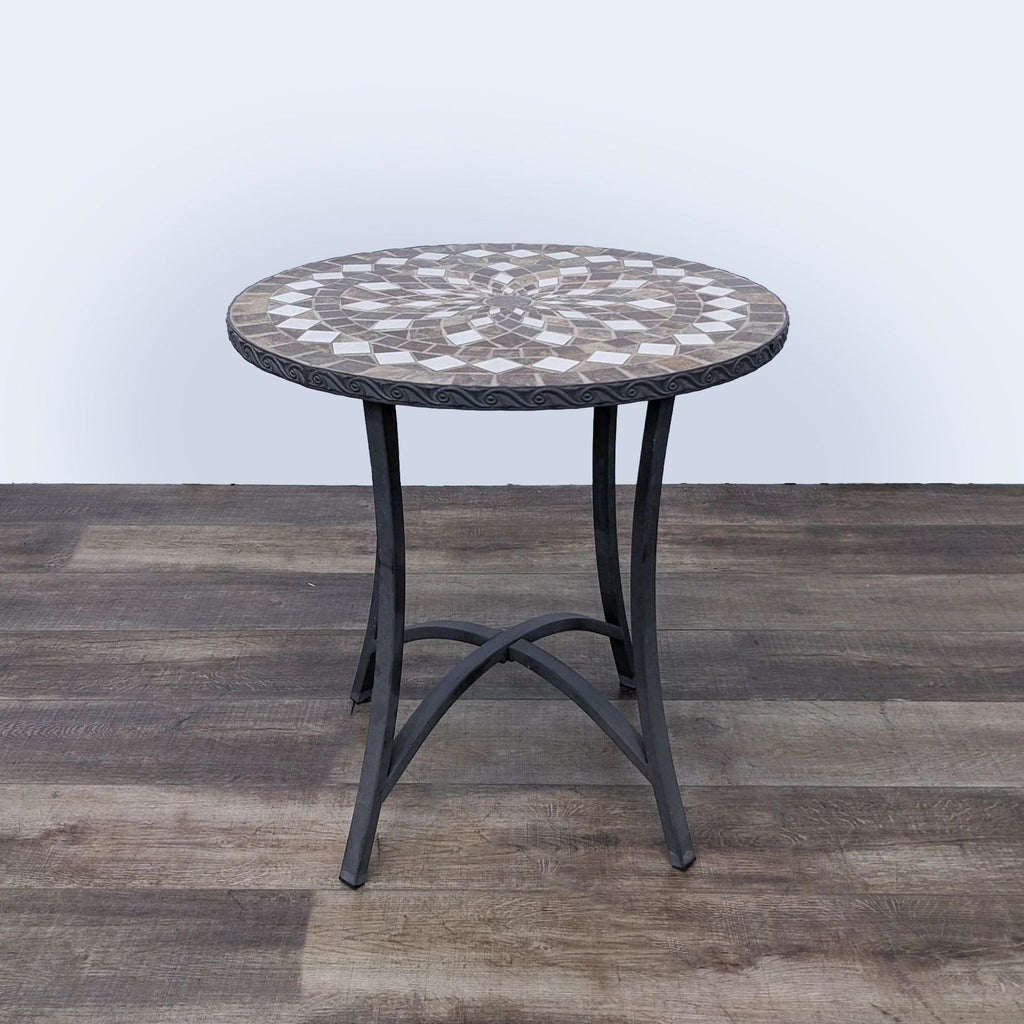 a round table with a mosaic pattern.