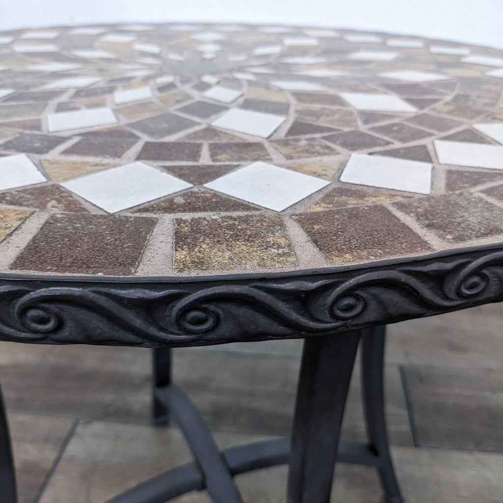 a round table with a mosaic tile top.