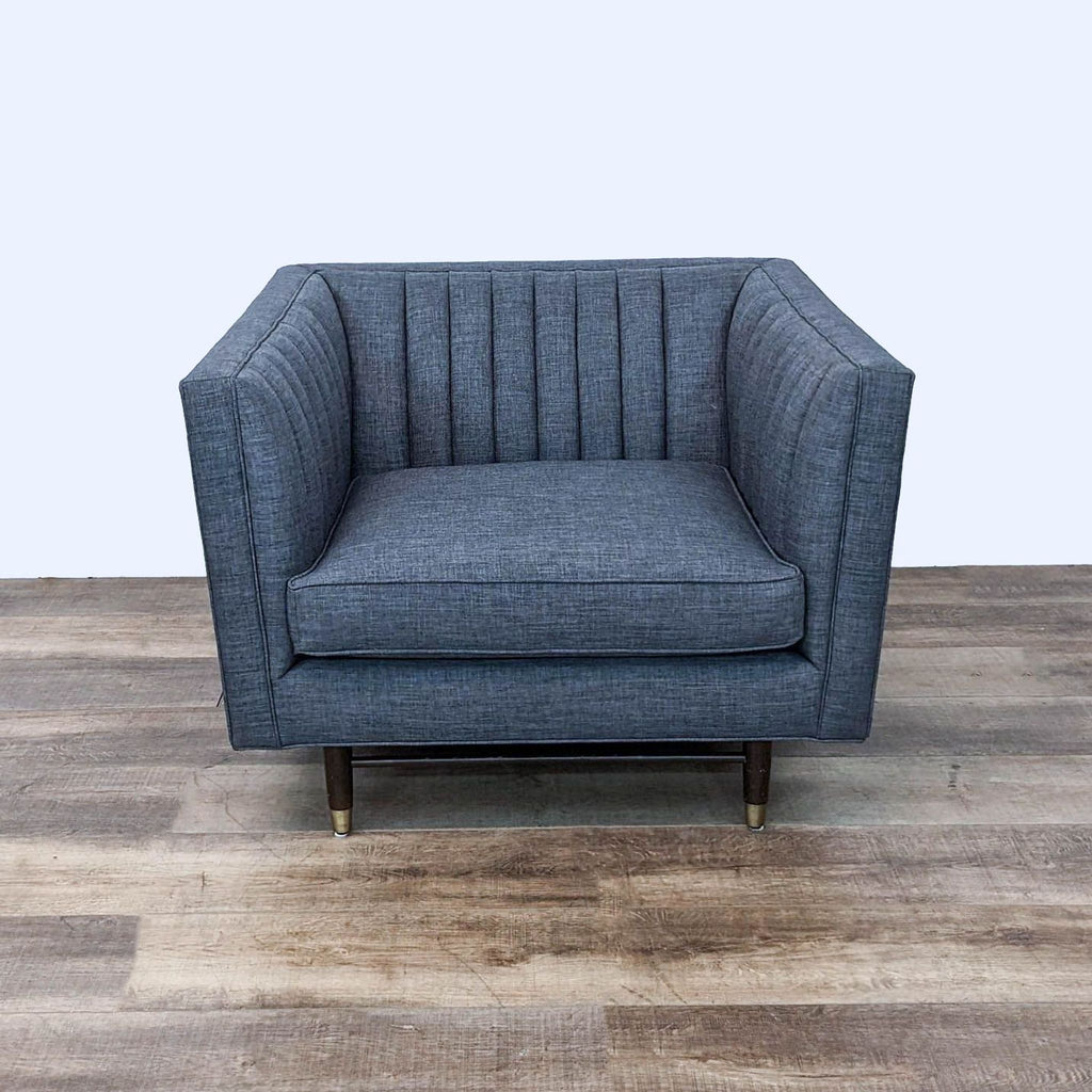 the [ unused0 ] - - upholstered in a dark grey wool fabric.