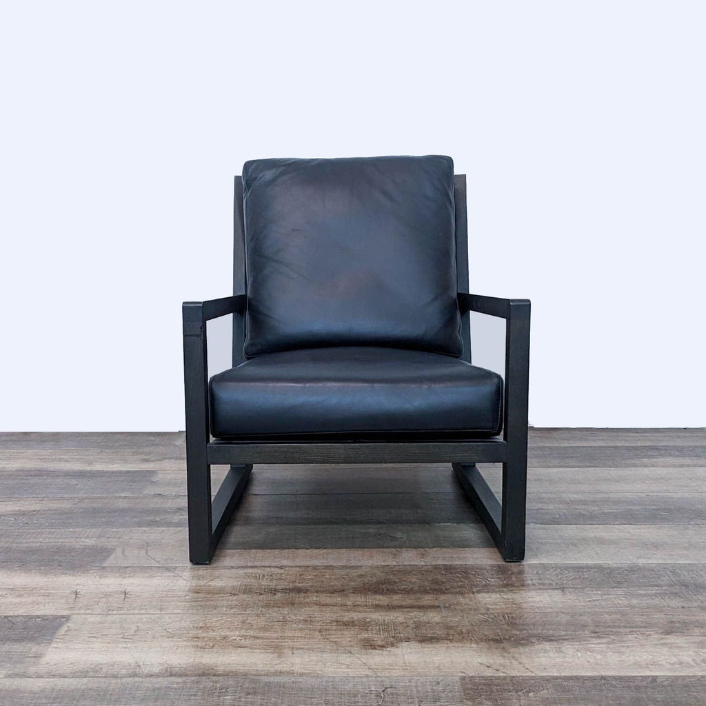 a pair of black leather lounge chairs in the style of [ unused0 ]