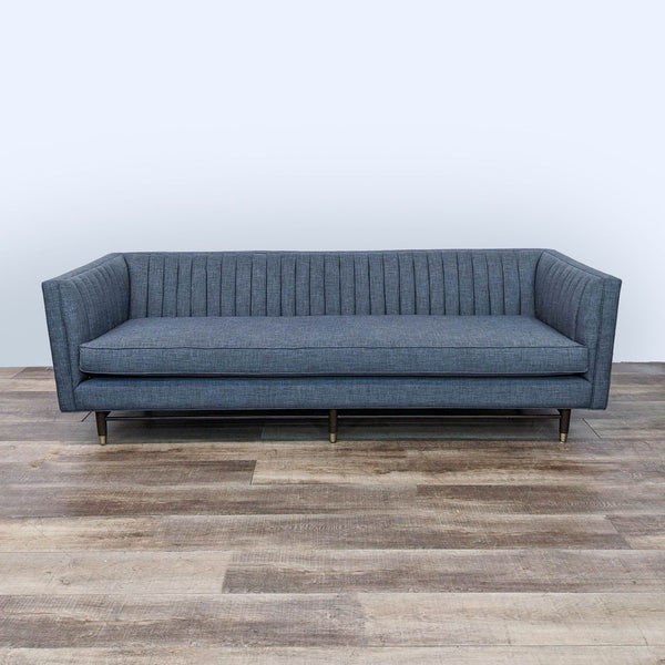 sofa is a modern sofa with a modern design. the sofa is made from a dark grey fabric