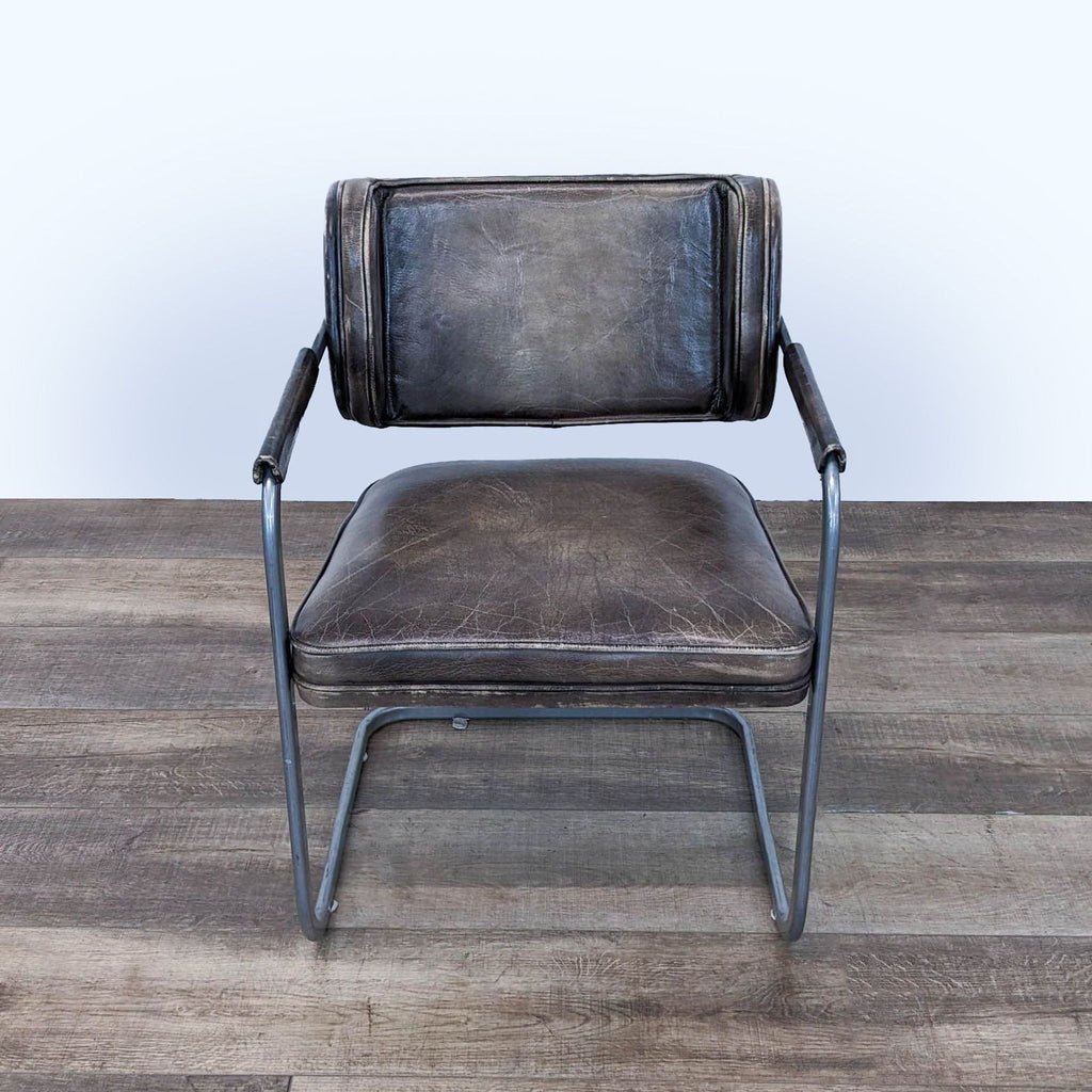 a pair of vintage italian leather and metal chairs