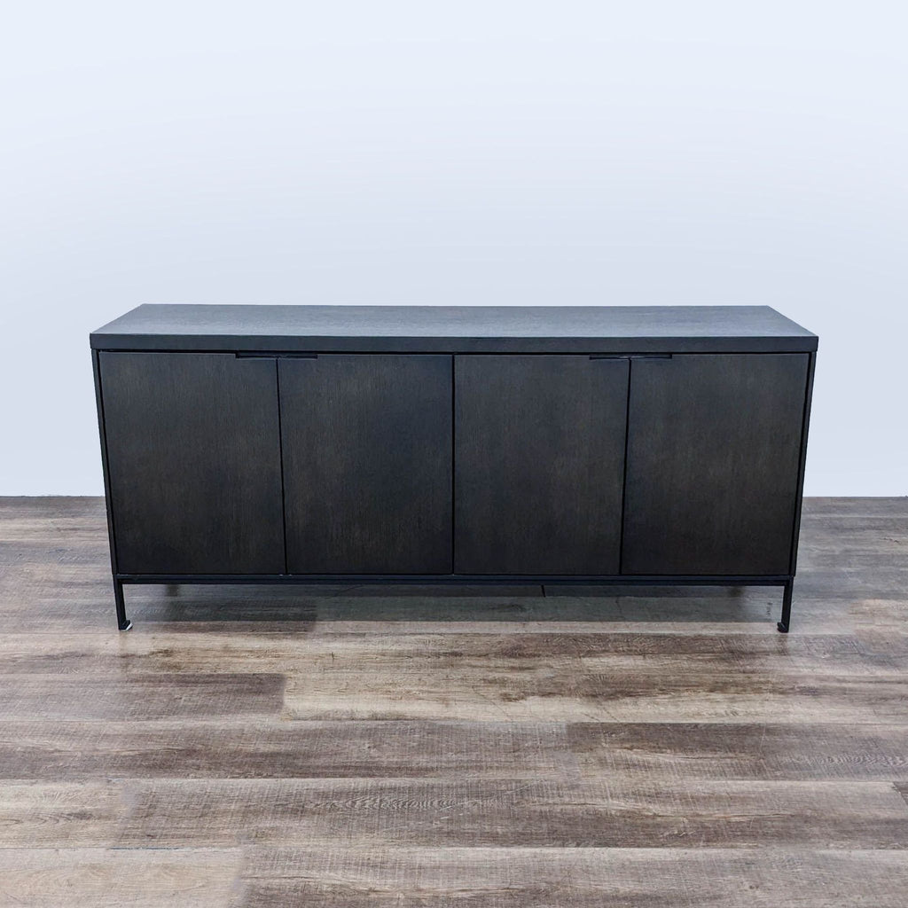 the urban port sideboard is made of solid wood with a black finish. the door is made