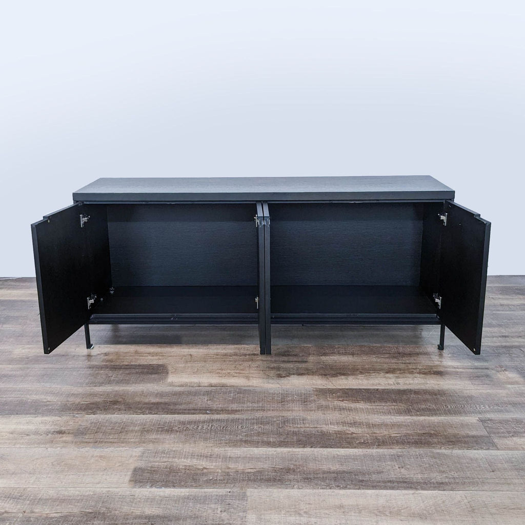 the black metal sideboard is a modern, contemporary design. the top is made of a black