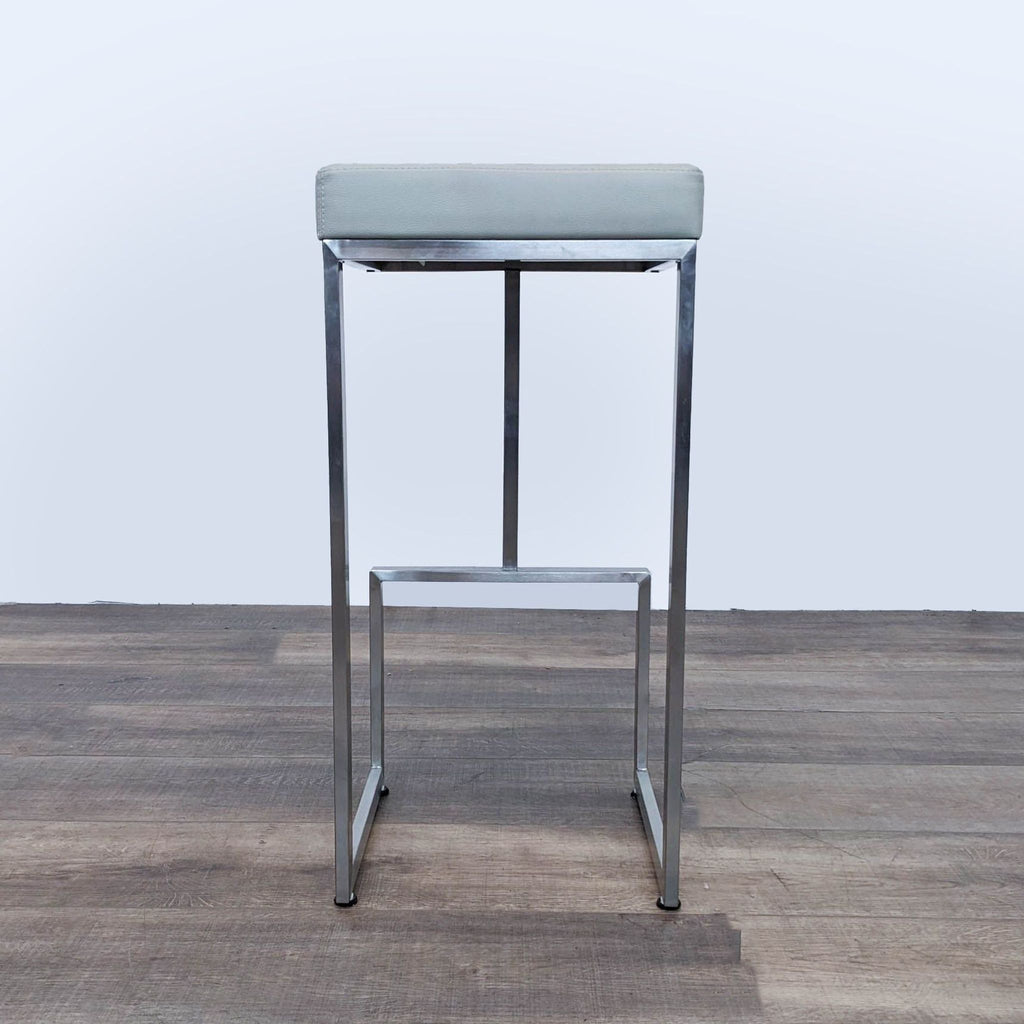 a chrome and steel stool by [ unused0 ]
