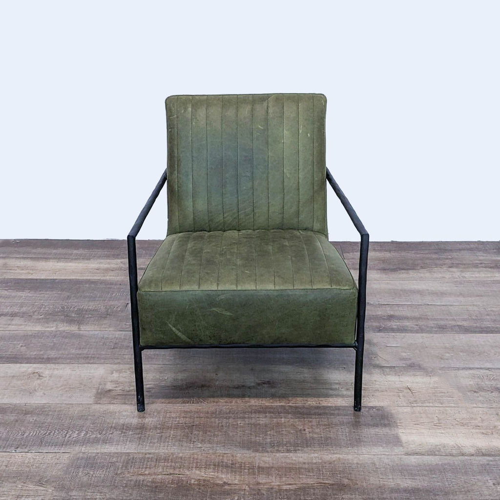 a pair of vintage green velvet lounge chairs.