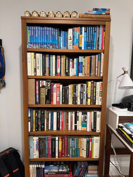 Certainly! However, I don't see the images or full description attached. Based on what you've provided—that the item is a bookshelf from Room & Board—here are three distinct, summarized alt text examples, each under 100 characters: